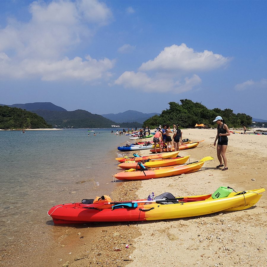 Kayaks lined up alongside one of Hong Kong’s beaches.